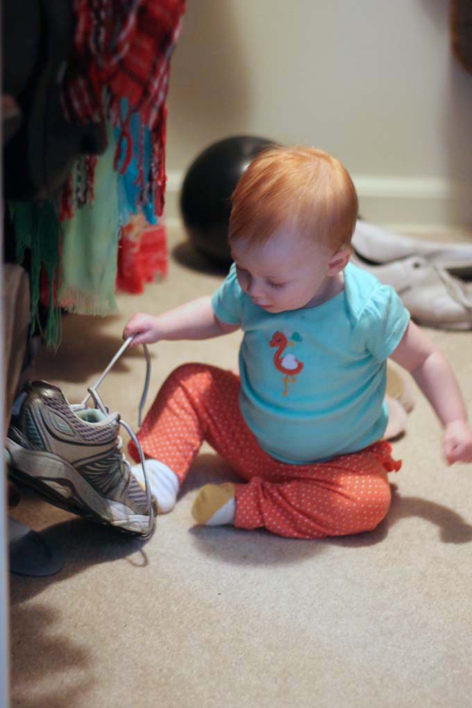 Eight-Month Old Baby Playing in Mommy's Closet