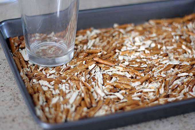 Use a glass to crush pretzels for chocolate-covered pretzel brownies