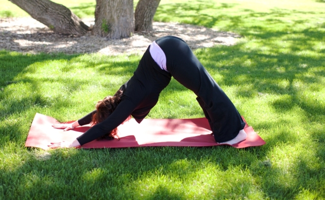 Maggie doing yoga in a park