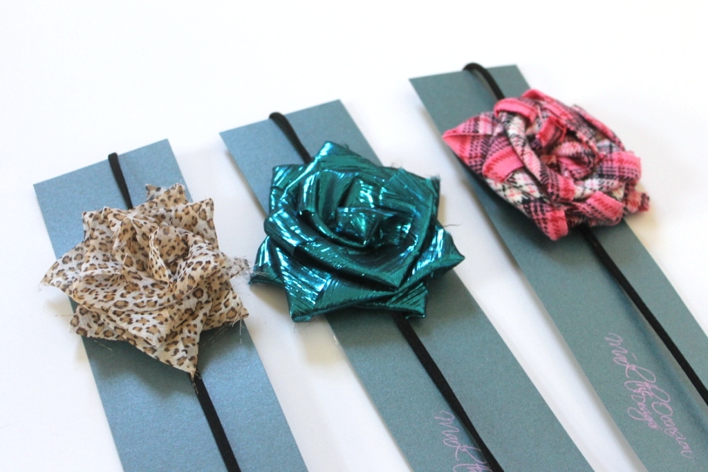 Black headbands with large fabric flowers